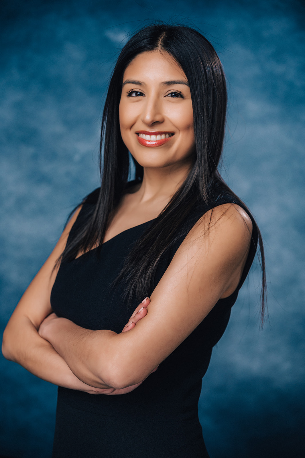 Professional Headshot — Blue Background